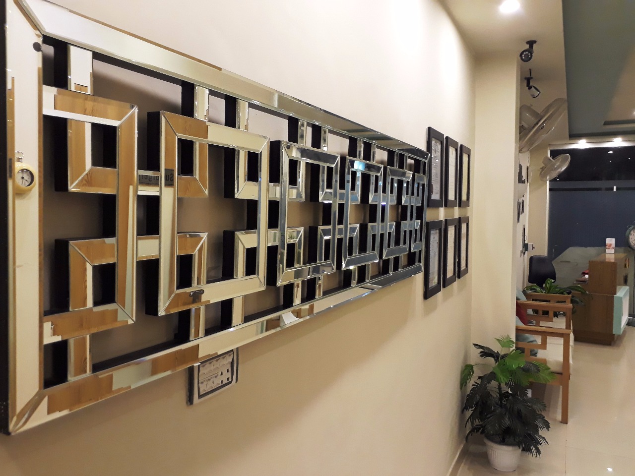 Signature brass geometric wall installation