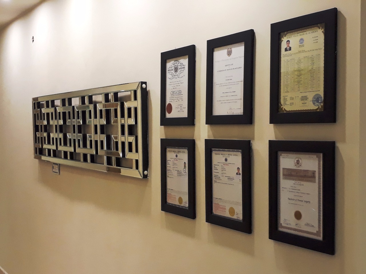 Wall of framed dentistry credentials