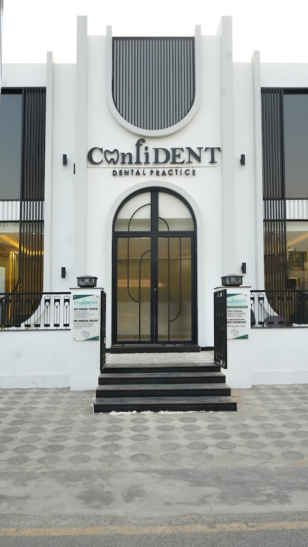 ConfiDENT storefront at night, illuminated facade