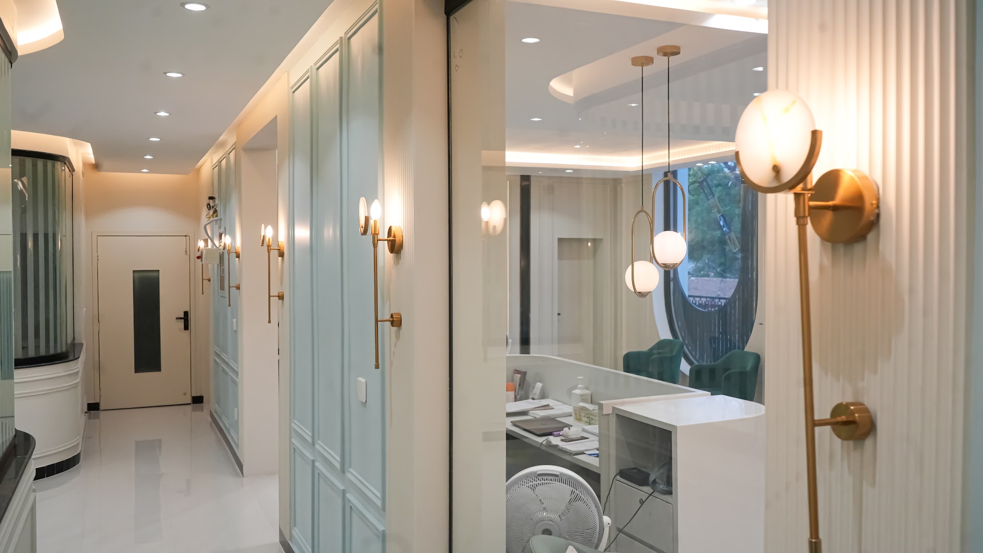Curved hallway with pendant lighting