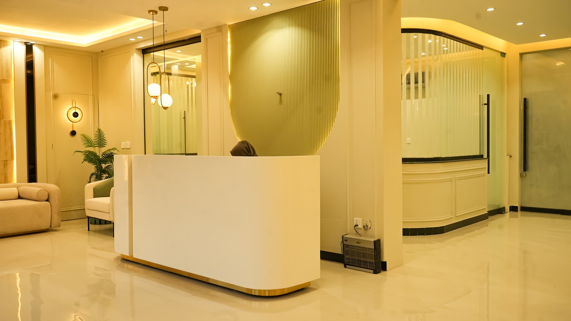 Reception lobby with sage pillars and warm lighting
