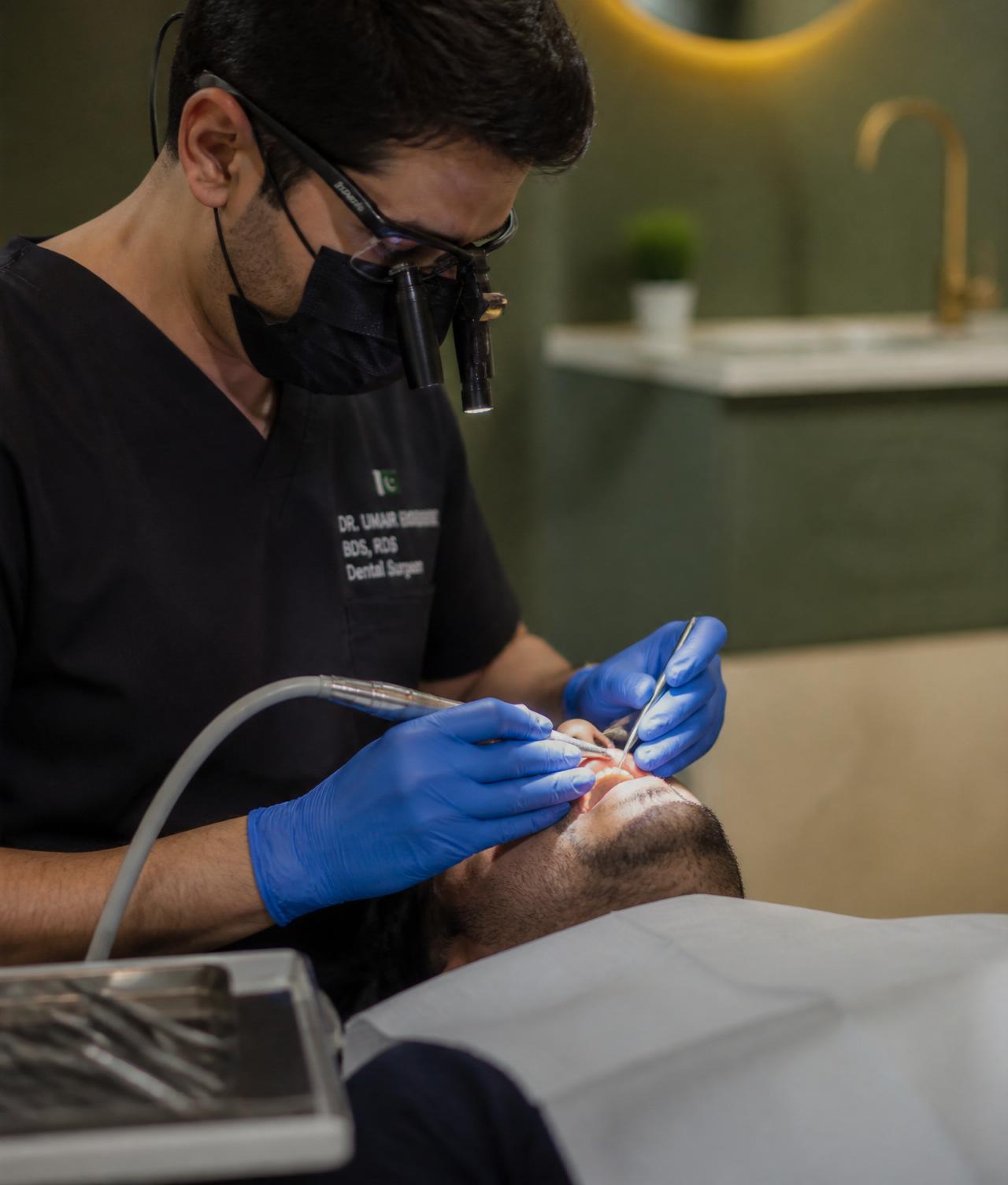 Dentist treating a patient at ConfiDENT